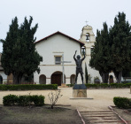 Statue, cross, and bell tower