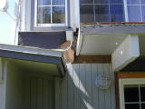 siding removed around rear balcony