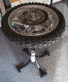 Wheel on tire changing stand