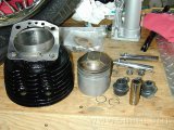 Cylinder and pistons